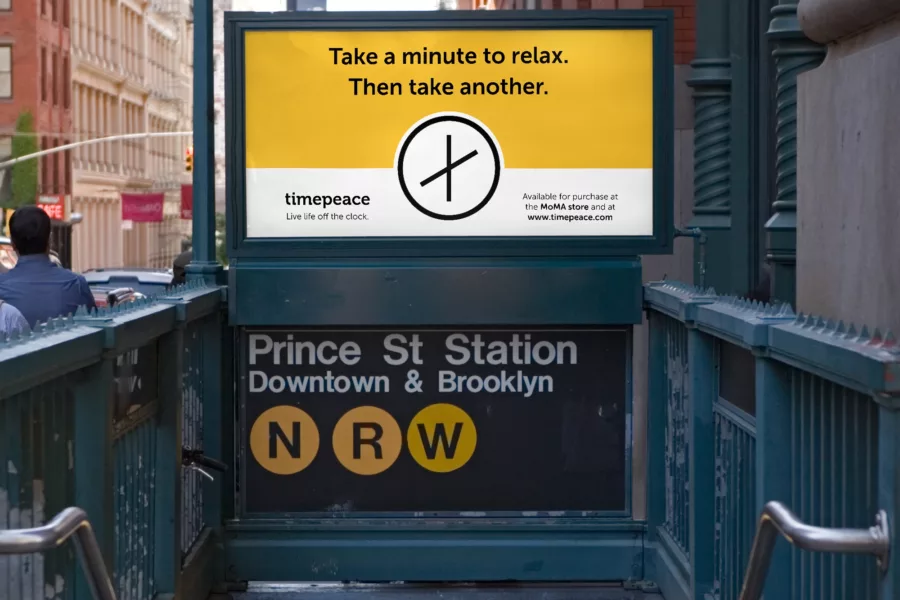 Mock-up of subway ad displaying Timepeace logo and text reading 'Take a minute to relax. Then take another.'